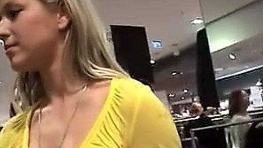 Cute German girl gives a dressing room blowjob and swallows