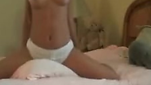 Young teen is masturbating with a pillow to orgasm