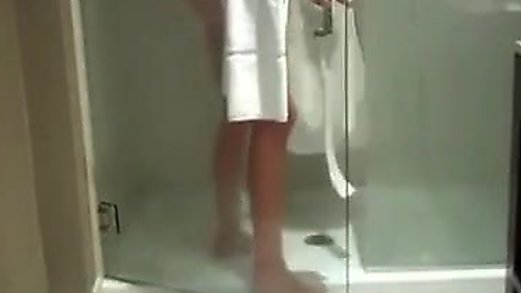 aunt gives a big blowjob to her nephew in the shower