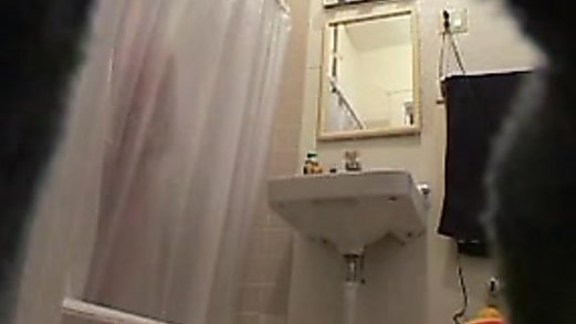 Hot teen caught naked in the bathroom on hidden cam